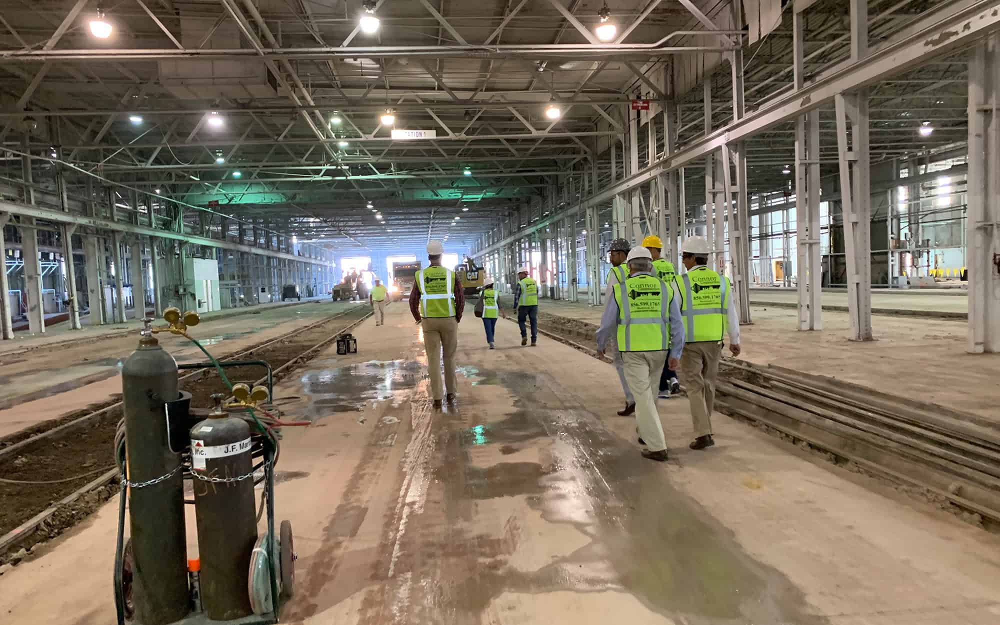Back view of Connor Construction employees walking on site