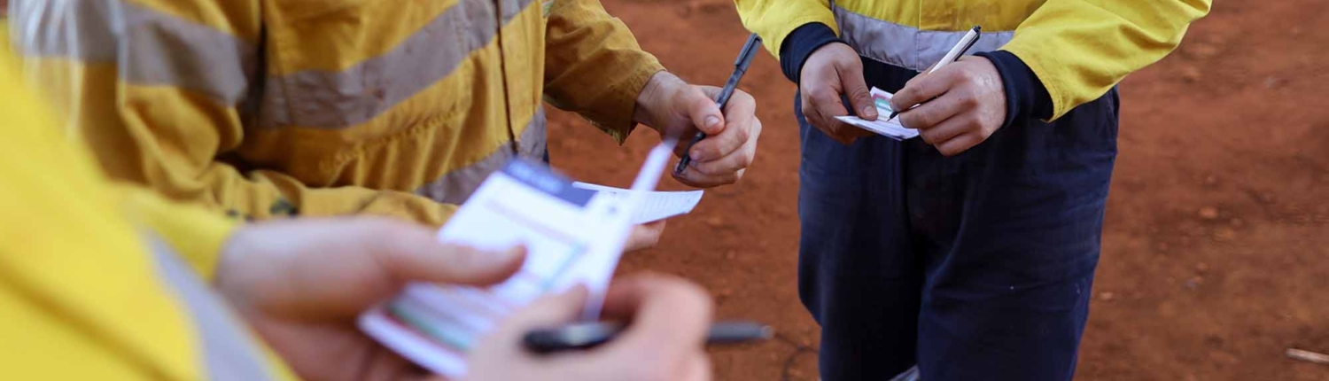 construction workers taling notes and planning